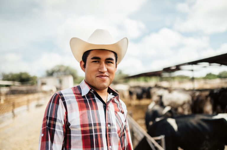 Mexican farmer working in cattle farm