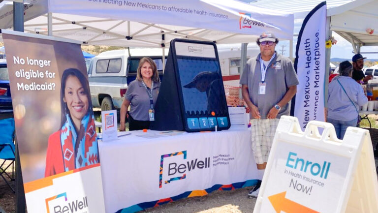 Two BeWell employees at the Gallup Flea market at the BeWell booth