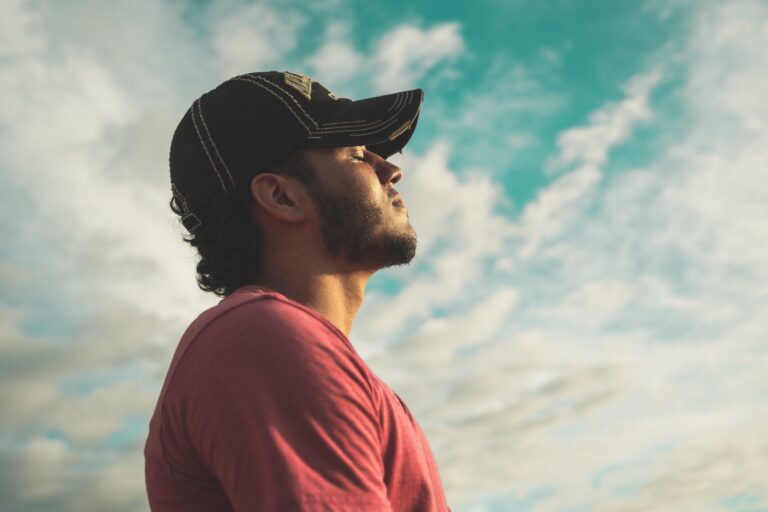 A man outside breathing fresh air