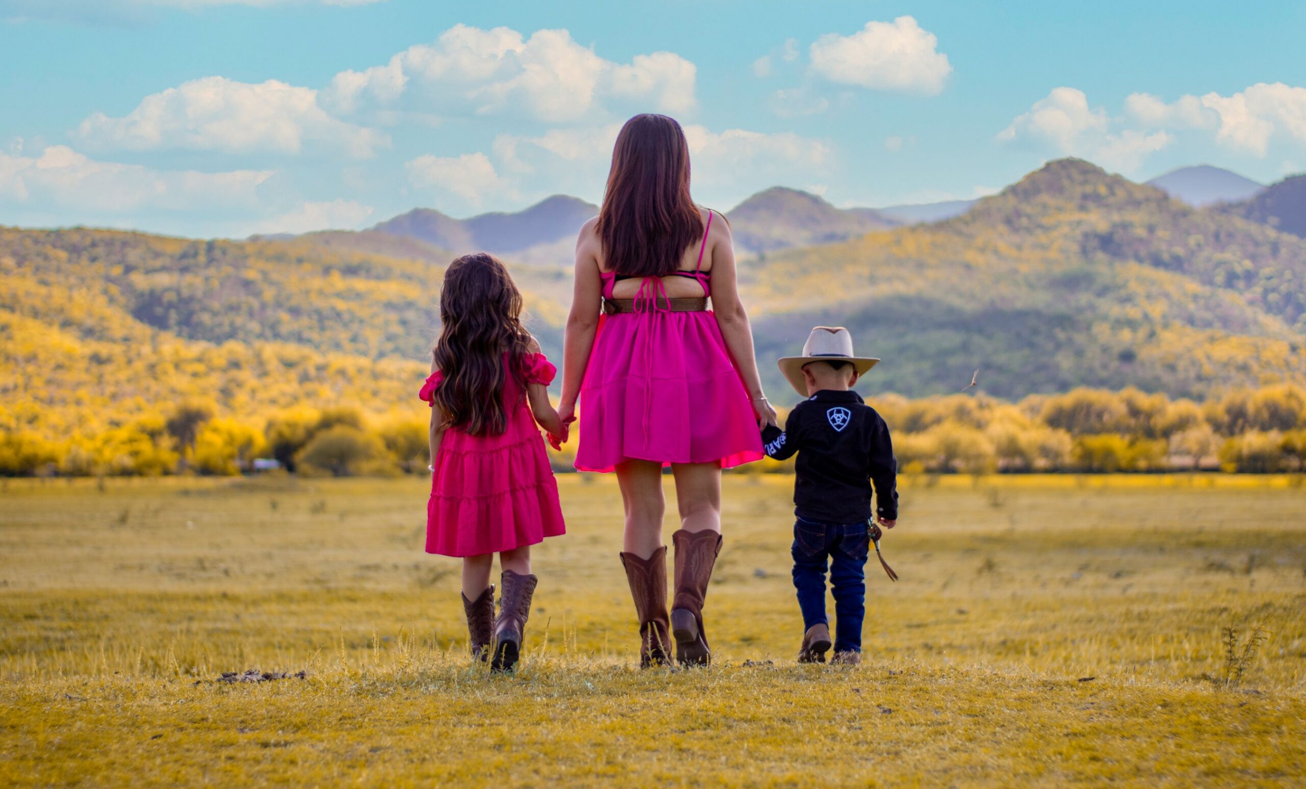 New Mexican family standing holding hands